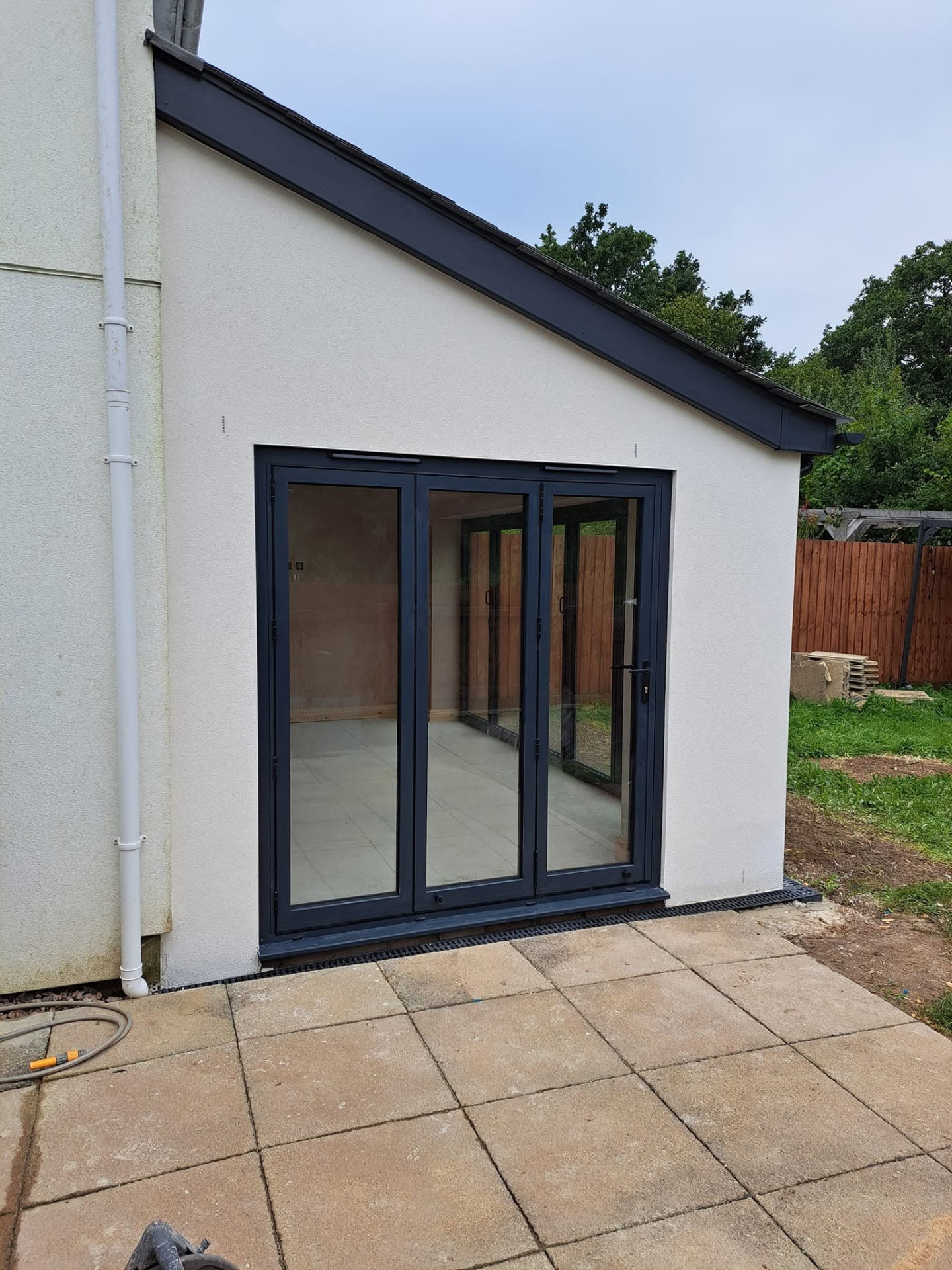 House extension: bifold doors patio, completed work, supplied project photograph